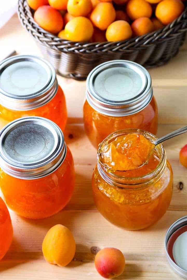 Four filled jars with lids.
