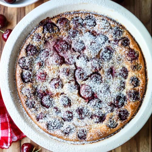 Cherry clafoutis in a round pie dish.